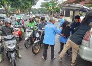 Jumat Berbagi, PWI Sumsel Bagikan Ratusan Nasi Kotak ke Ojol dan Abang Becak